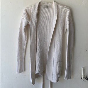 A cream colored cardigan